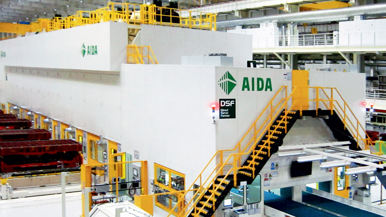 Tandem press line from Aida Engineering in an automotive production facility.