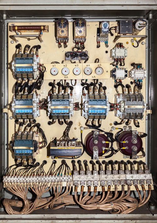 Old service panel with contactors and fuses.
