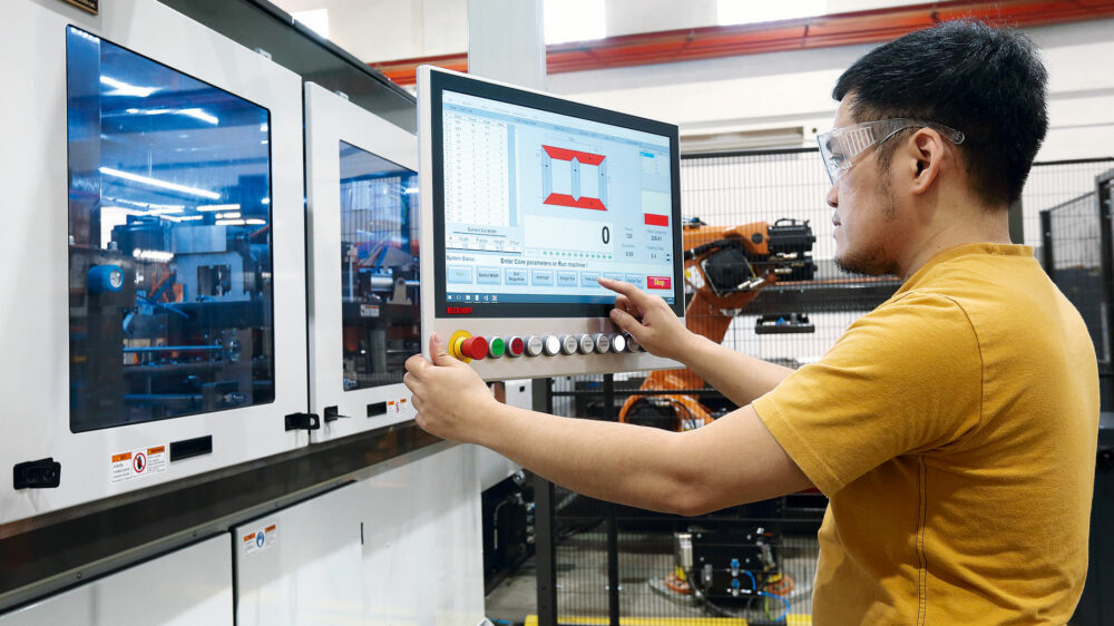 The 21.5-inch CP3921 multi-touch Control Panel with custom push-button extensions provides operator interface for the cutting cell, with a smaller touchscreen on the stacking cell. Picture: © Beckhoff