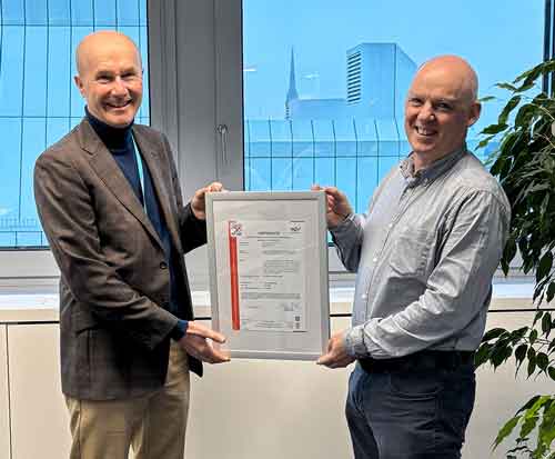 Presentation of the IEC 62443-4-2 certificate by Alexander Zeppelzauer, Sales Director TÜV TRUST IT (left), to Erwan Sudrat, Director of Product Development at TTTECH Industrial (right). © Copyright TTTECH Industrial